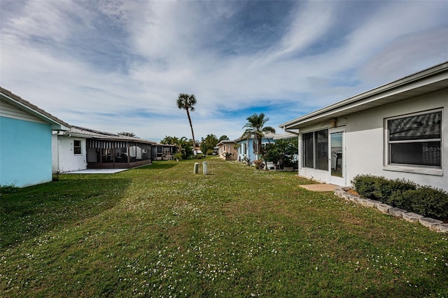 view of yard featuring a sunroom