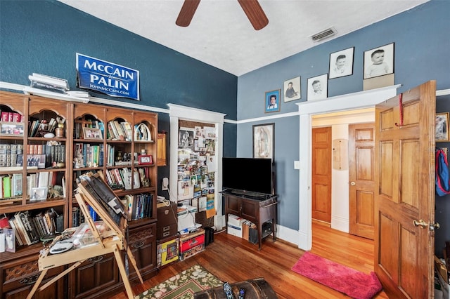 interior space featuring hardwood / wood-style floors and ceiling fan