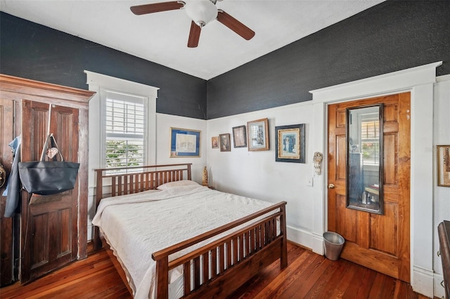 bedroom featuring hardwood / wood-style floors and ceiling fan