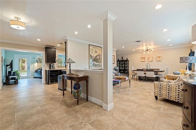 interior space featuring ornate columns and crown molding