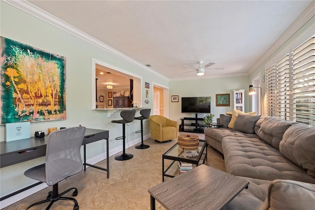 living room featuring a textured ceiling, ceiling fan, and ornamental molding