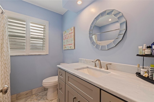 bathroom with vanity and toilet