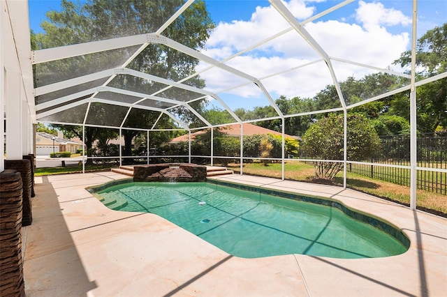 view of pool featuring a lanai and a patio