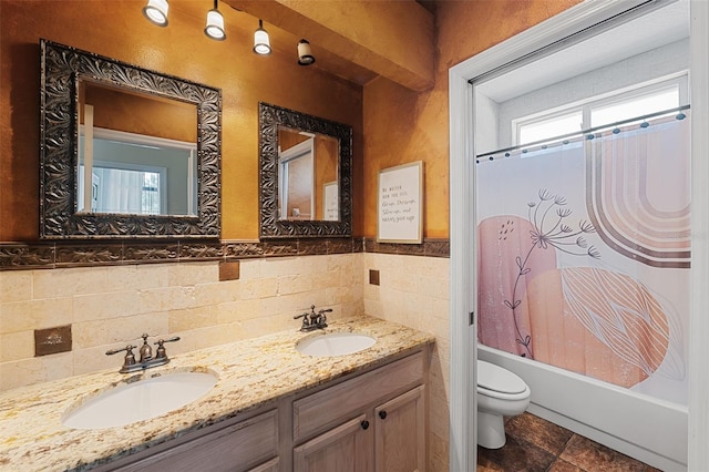 full bathroom with shower / bath combination with curtain, vanity, and toilet