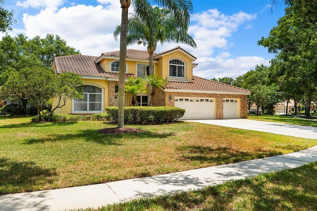 mediterranean / spanish-style house featuring a front yard and a garage