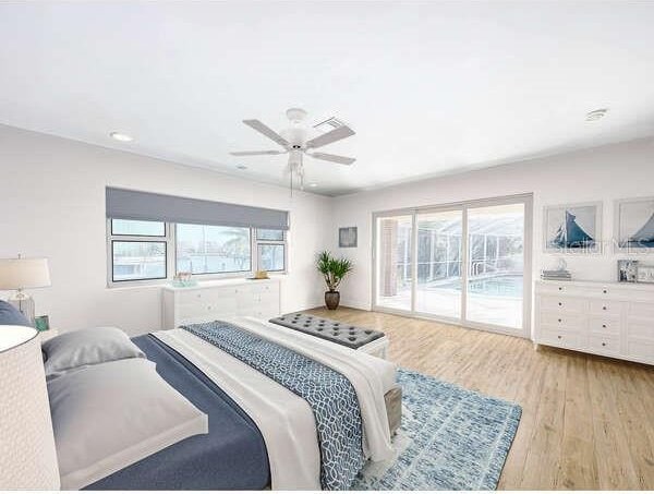 bedroom featuring access to outside, multiple windows, light hardwood / wood-style floors, and ceiling fan