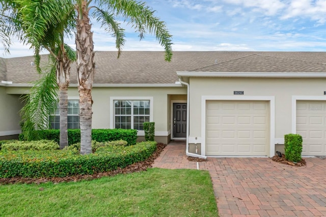 ranch-style house featuring a garage