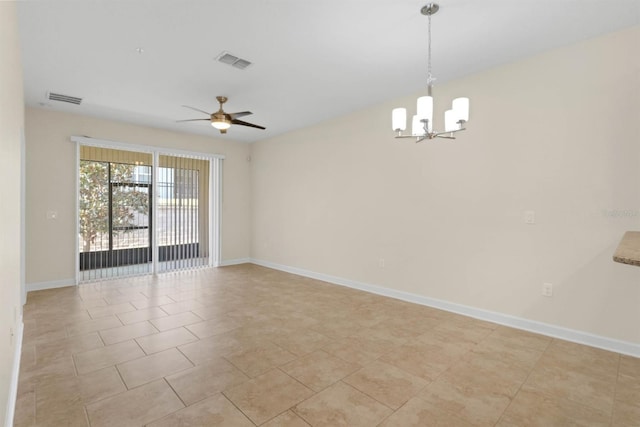 spare room featuring ceiling fan with notable chandelier and light tile patterned flooring