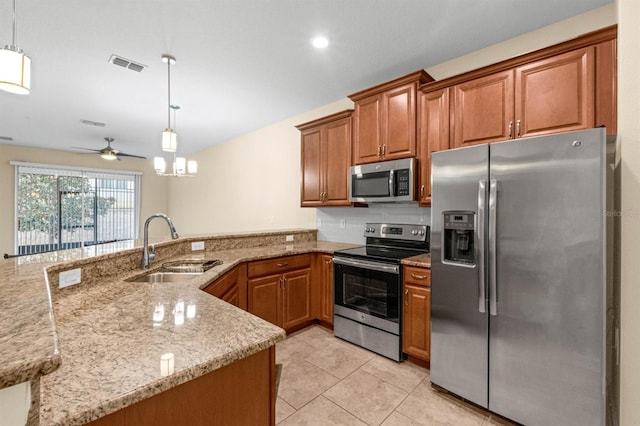 kitchen with kitchen peninsula, decorative light fixtures, stainless steel appliances, and ceiling fan