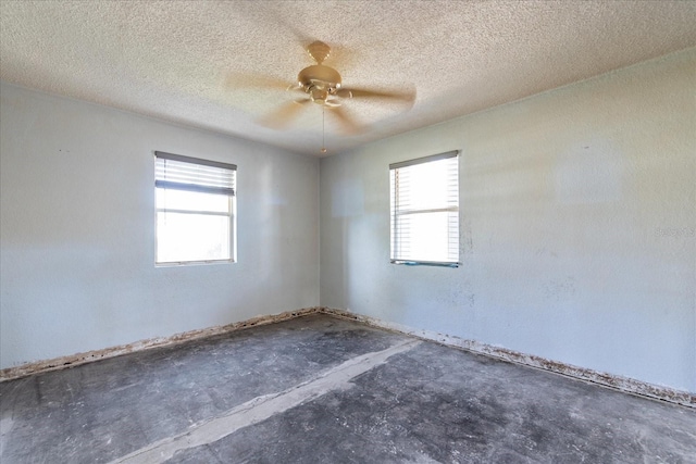 unfurnished room featuring a textured ceiling and ceiling fan