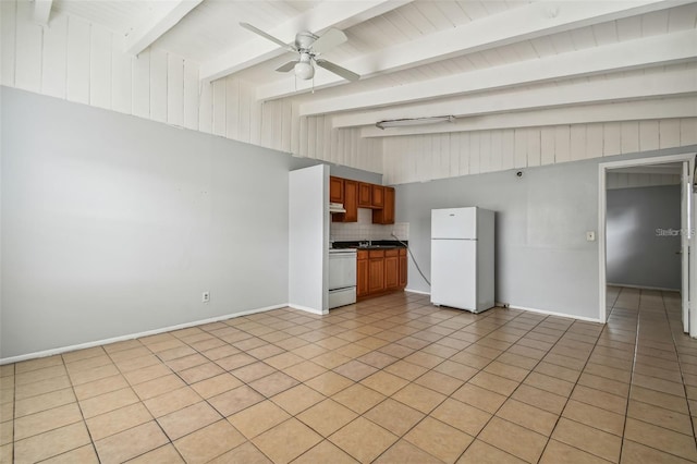 unfurnished living room with light tile patterned floors, lofted ceiling with beams, ceiling fan, and sink