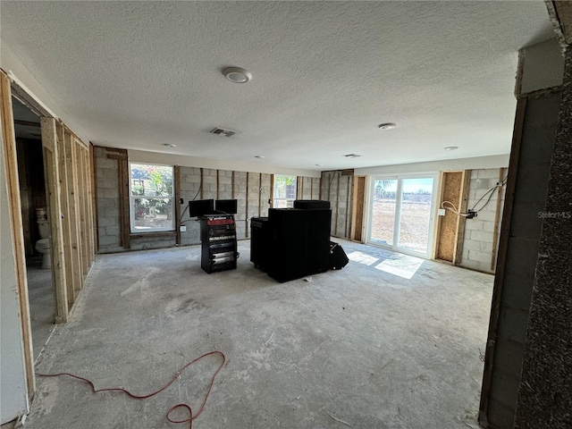 interior space with a textured ceiling