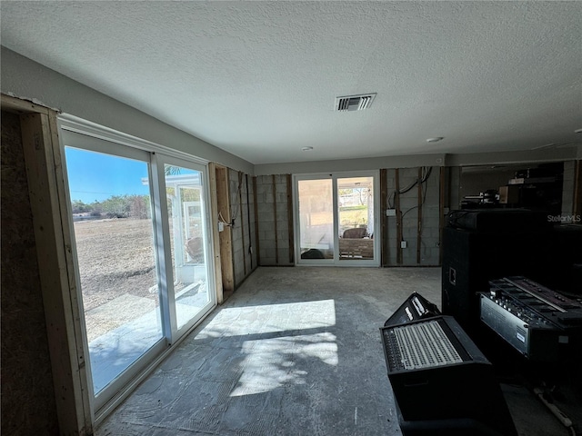 interior space featuring a textured ceiling