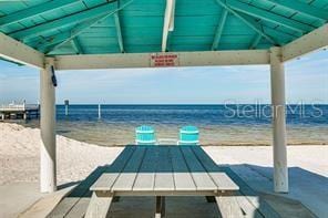 3960 Headsail Dr, New Port Richey, FL 34652 - dock featuring a gazebo and view of water and beach