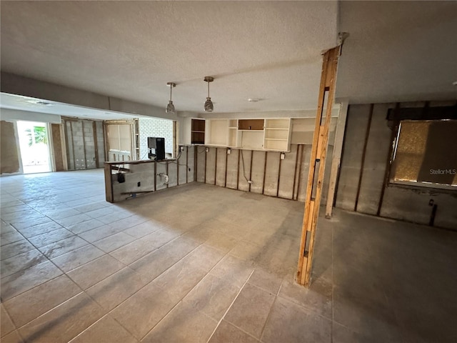 3960 Headsail Dr, New Port Richey, FL 34652 - unfurnished living room with a textured ceiling