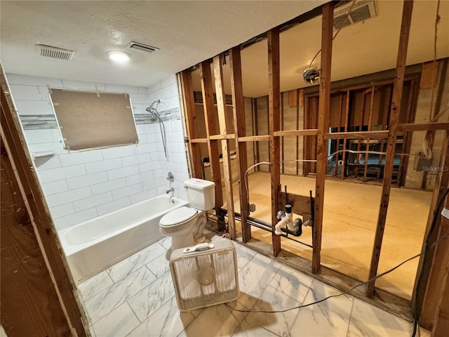 3960 Headsail Dr, New Port Richey, FL 34652 - full bathroom featuring toilet, shower / washtub combination, marble finish flooring, and a textured ceiling