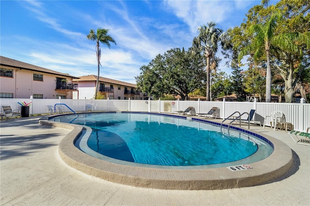 view of pool featuring a patio