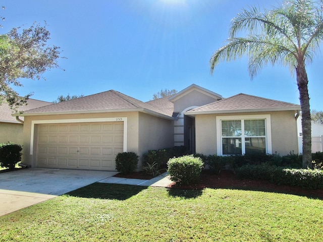 ranch-style house with a garage and a front lawn