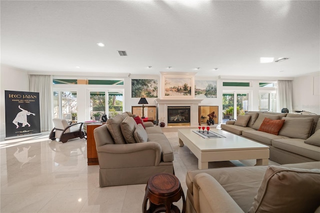 living room with a textured ceiling and ornamental molding