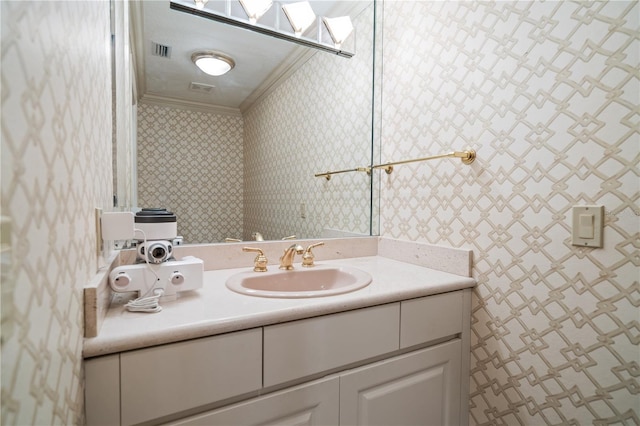 bathroom with vanity and crown molding