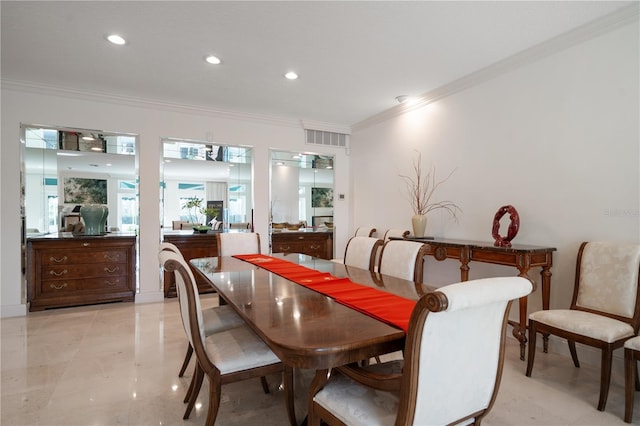 dining space featuring ornamental molding