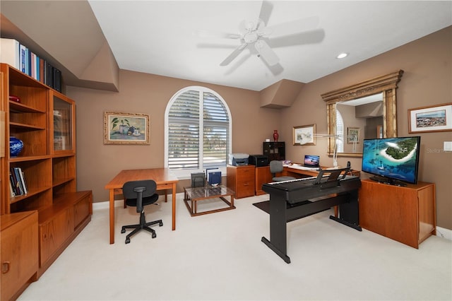 carpeted office with ceiling fan