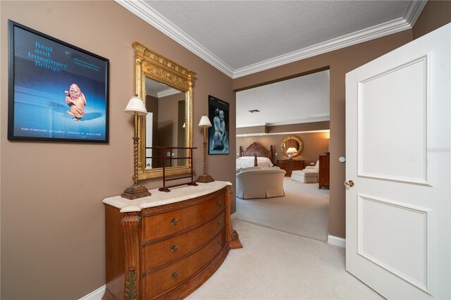 corridor featuring crown molding, light colored carpet, and a textured ceiling