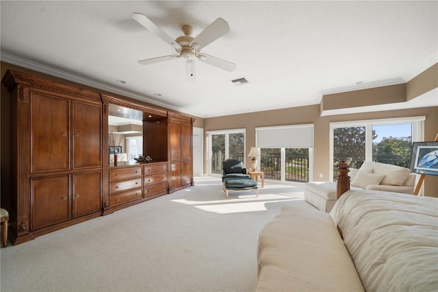 bedroom with carpet, ceiling fan, and crown molding