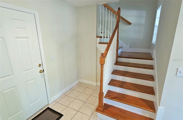 stairs with tile patterned flooring