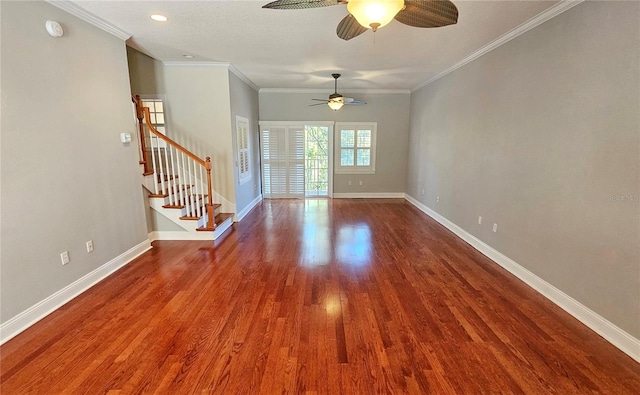 spare room featuring hardwood / wood-style floors, ceiling fan, and ornamental molding