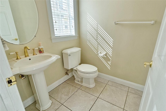 bathroom featuring tile patterned flooring and toilet