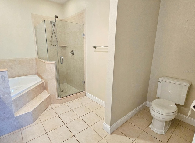 bathroom with tile patterned flooring, separate shower and tub, and toilet