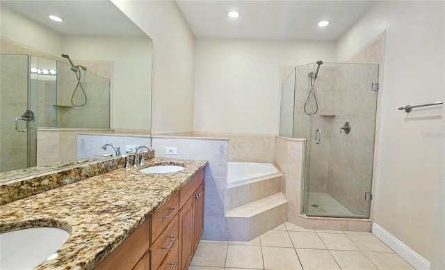 bathroom with tile patterned flooring, vanity, and separate shower and tub