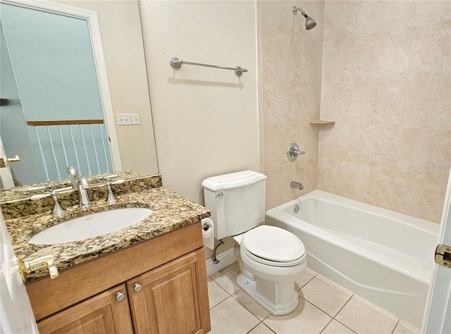 full bathroom with tile patterned flooring, vanity, toilet, and tiled shower / bath