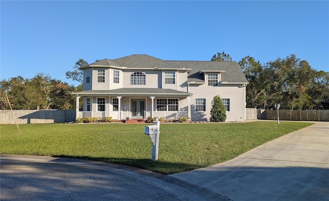 view of front of house featuring a porch and a front yard