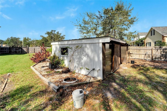 view of outdoor structure featuring a yard