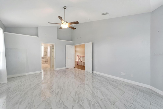 unfurnished bedroom featuring ceiling fan and high vaulted ceiling