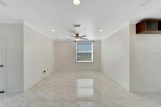 spare room with a textured ceiling, ceiling fan, and ornamental molding