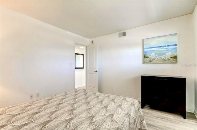 unfurnished bedroom with light hardwood / wood-style floors