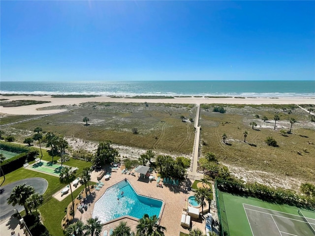 birds eye view of property featuring a water view and a view of the beach