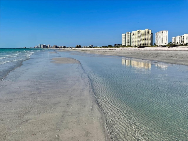 property view of water featuring a beach view