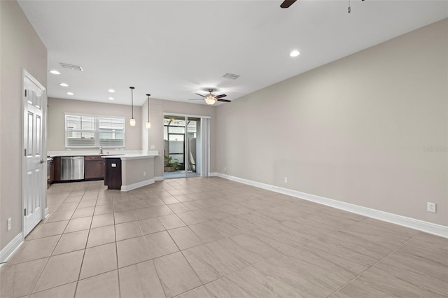 unfurnished living room featuring recessed lighting, visible vents, ceiling fan, and baseboards