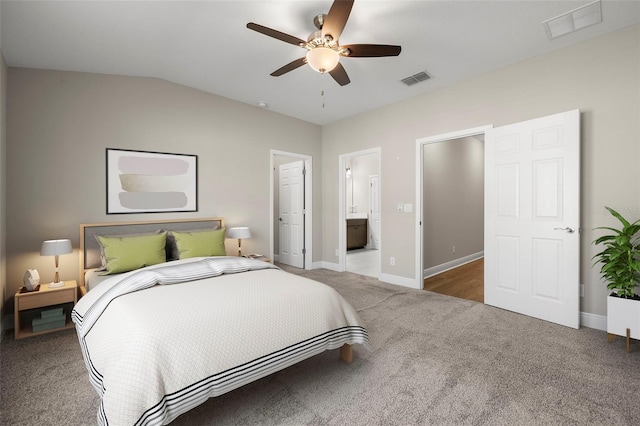 bedroom featuring connected bathroom, carpet floors, ceiling fan, and lofted ceiling