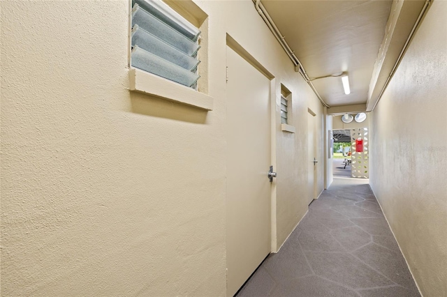 corridor featuring carpet flooring