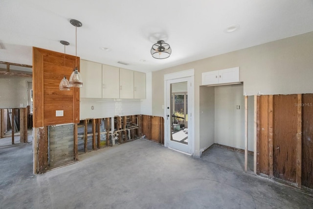 kitchen featuring white cabinets and pendant lighting