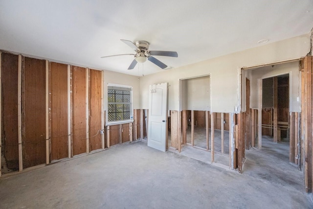 miscellaneous room featuring ceiling fan and concrete floors