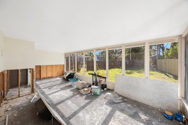 unfurnished sunroom featuring a wealth of natural light