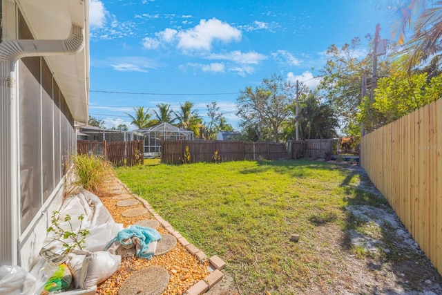 view of yard with a lanai