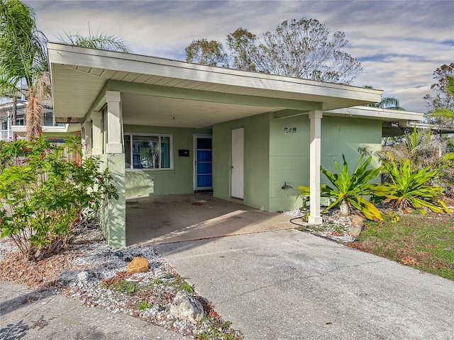 entrance to property with a carport