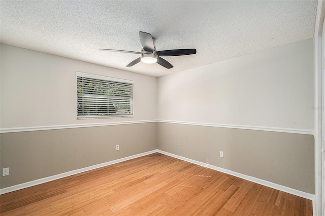 unfurnished room with a textured ceiling, hardwood / wood-style flooring, and ceiling fan